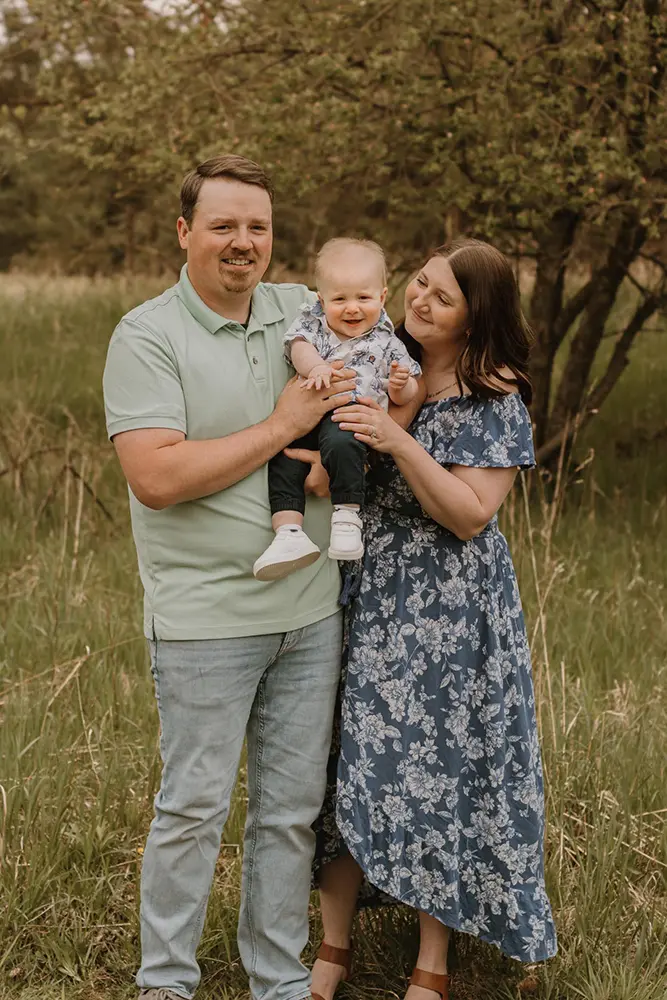 Tanner and Morgan Hafeman holding their baby